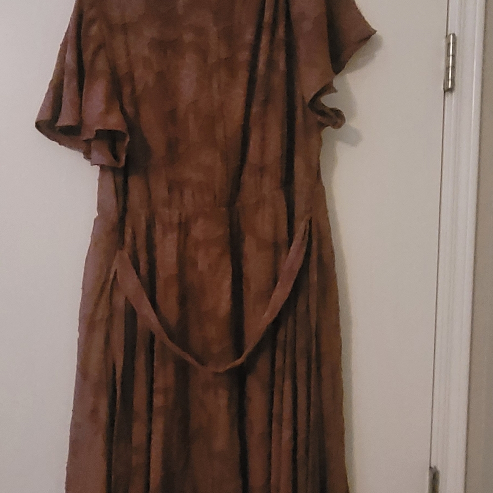 Lace like woman's dress from Torrd. Color is light marron